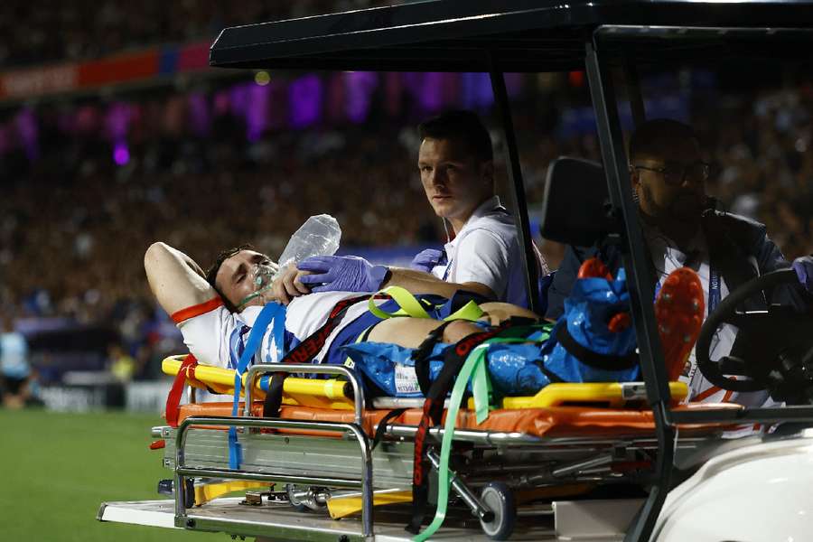 Namibia's Le Roux Malan is carried off on a buggy after sustaining his injury