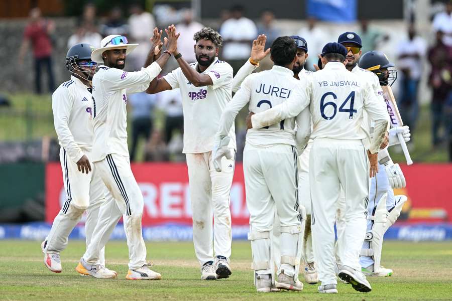 India's Mohammed Siraj celebrates with teammates after taking the wicket of Sri Lanka's Niroshan Dickwella on day three of the second Test India's Mohammed Siraj celebrates with teammates after taking the wicket of Sri Lanka's Niroshan Dickwella on day three of the second Test