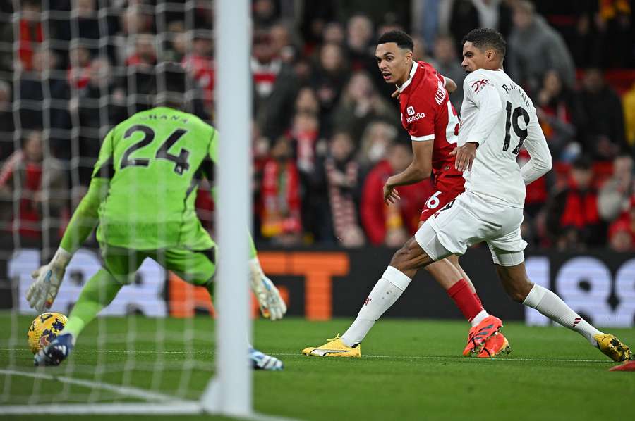 Andre Onana saves a shot from Liverpool's Trent Alexander-Arnold