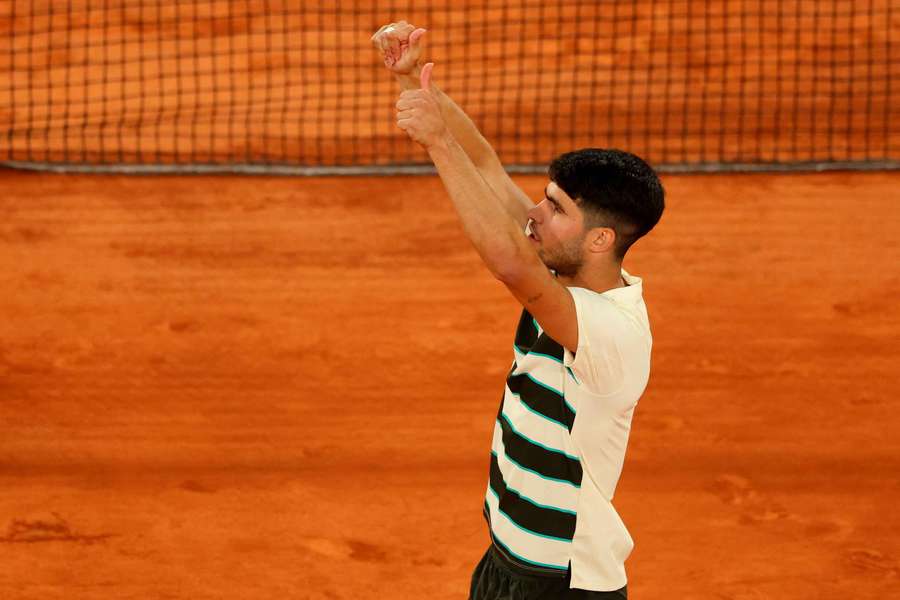 Carlos Alcaraz celebrates after winning his quarter-final match against Tommy Paul
