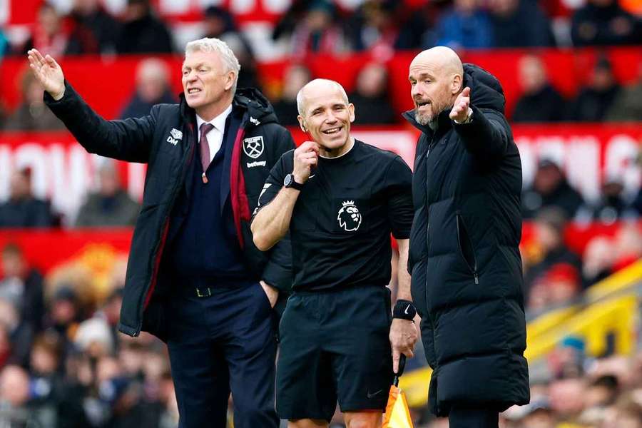 Manchester United manager Erik ten Hag protests a decision alongside former West Ham United manager David Moyes