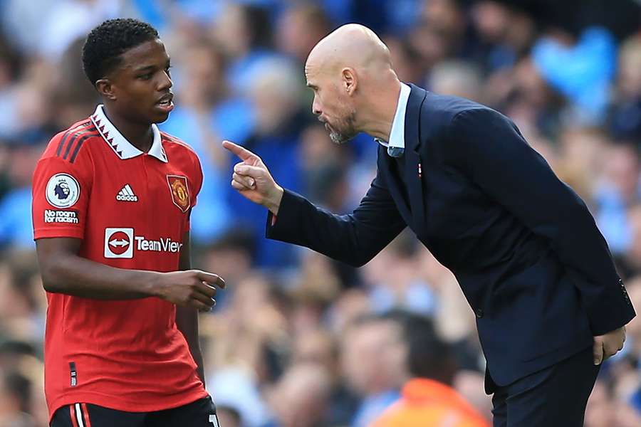 Manchester United manager Erik ten Hag speaks to Dutch defender Tyrell Malacia