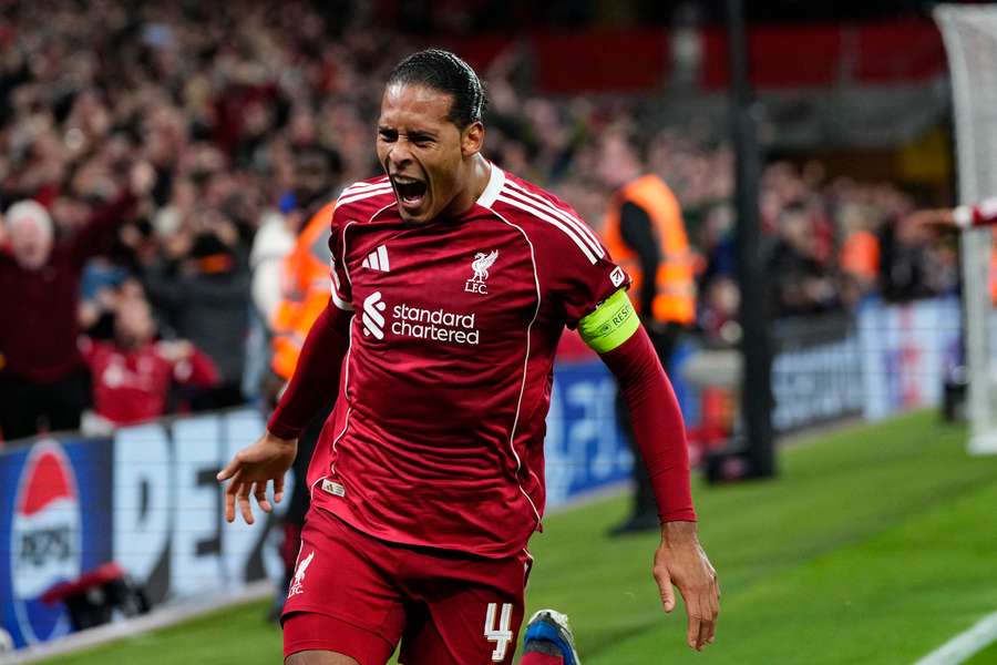 Virgil van Dijk celebrates after scoring in injury time