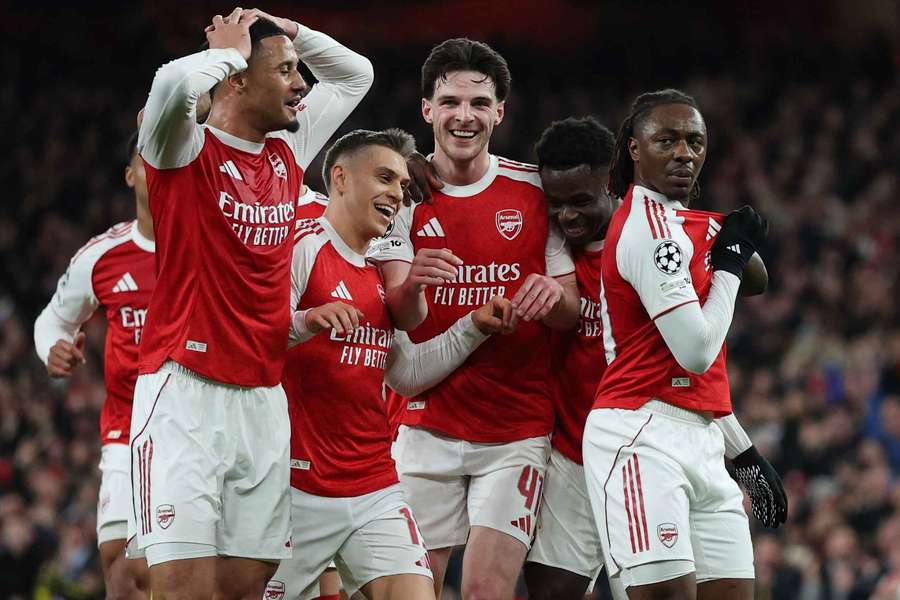 Arsenal's Eberechi Eze celebrates with William Saliba, Bukayo Saka, Leandro Trossard and Declan Rice