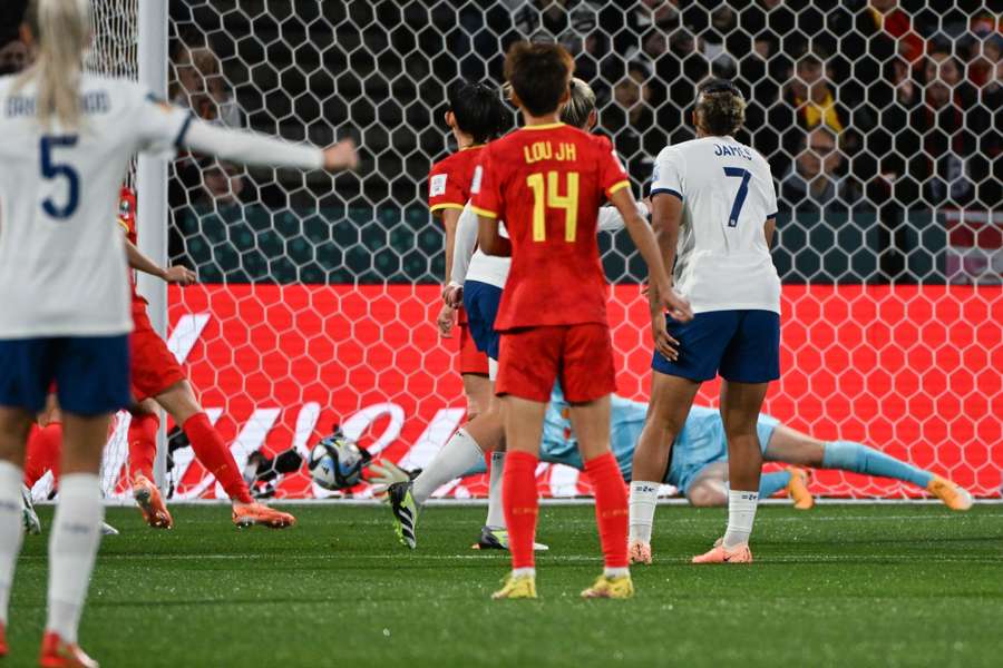 England's forward #23 Alessia Russo (obscured) scores her team's first goal