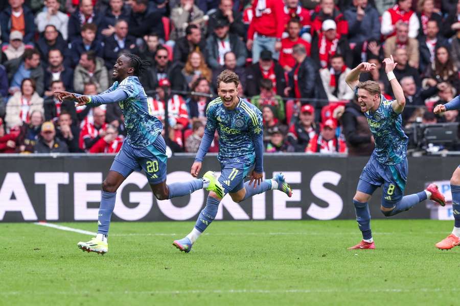 Ajax players celebrate after Bertrand Traore (L) scores the 2-0 against PSV