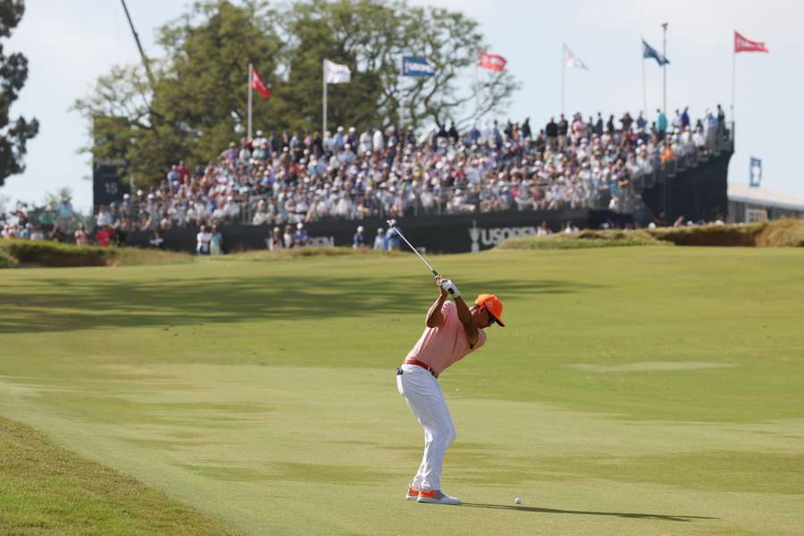 Rickie Fowler of the United States plays a second shot on the tenth hole during the final round