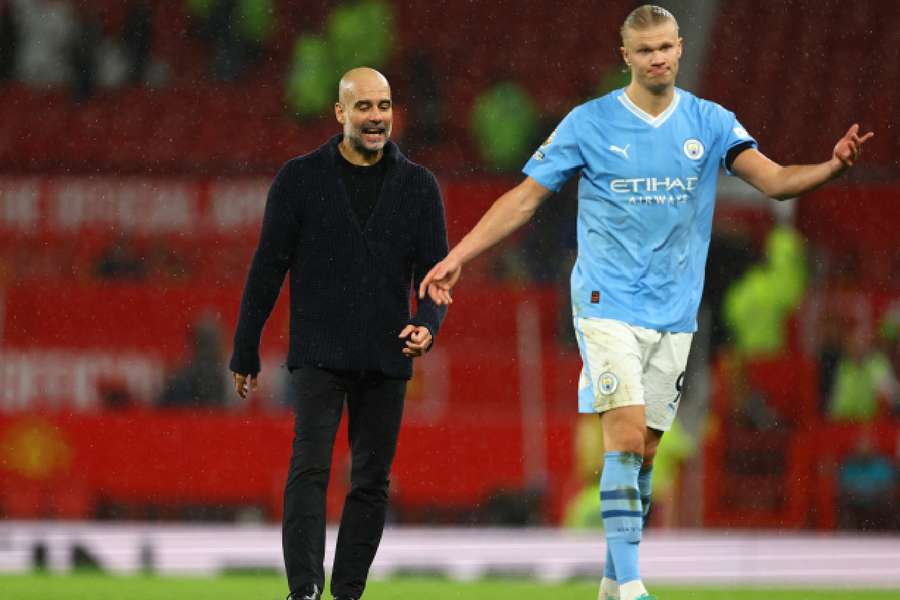 Haaland speaking to Guardiola after the game