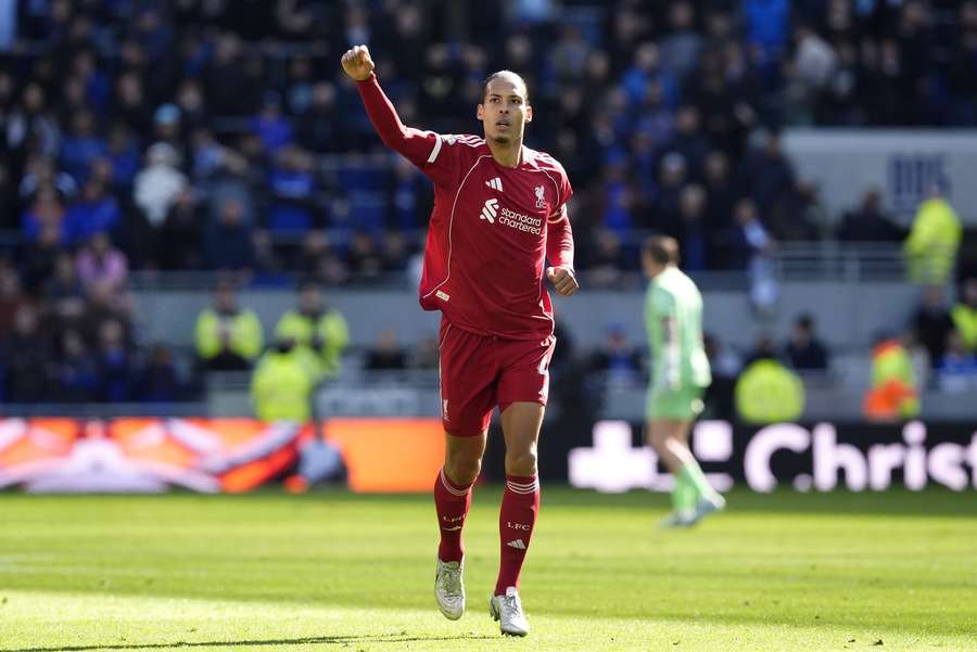 Liverpool's Virgil van Dijk celebrates scoring their side's second goal vs Everton