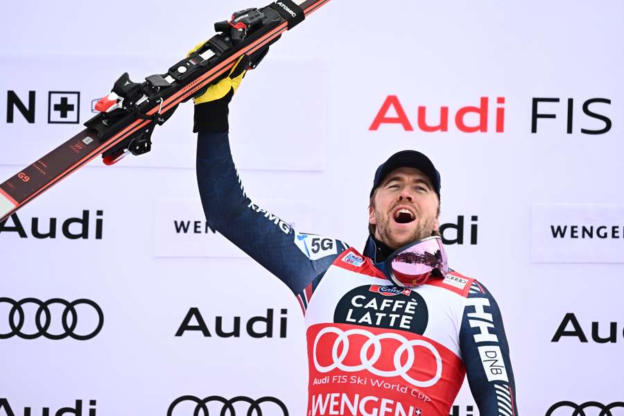 Norway's Aleksander Aamodt Kilde celebrates on the podium after winning the Downhill of the FIS Alpine Skiing Men's World Cup