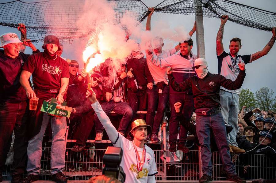Jannik Serra holding a flare while celebrating the Danish title with AGF fans Jannik Serra holding a flare while celebrating the Danish title with AGF fans