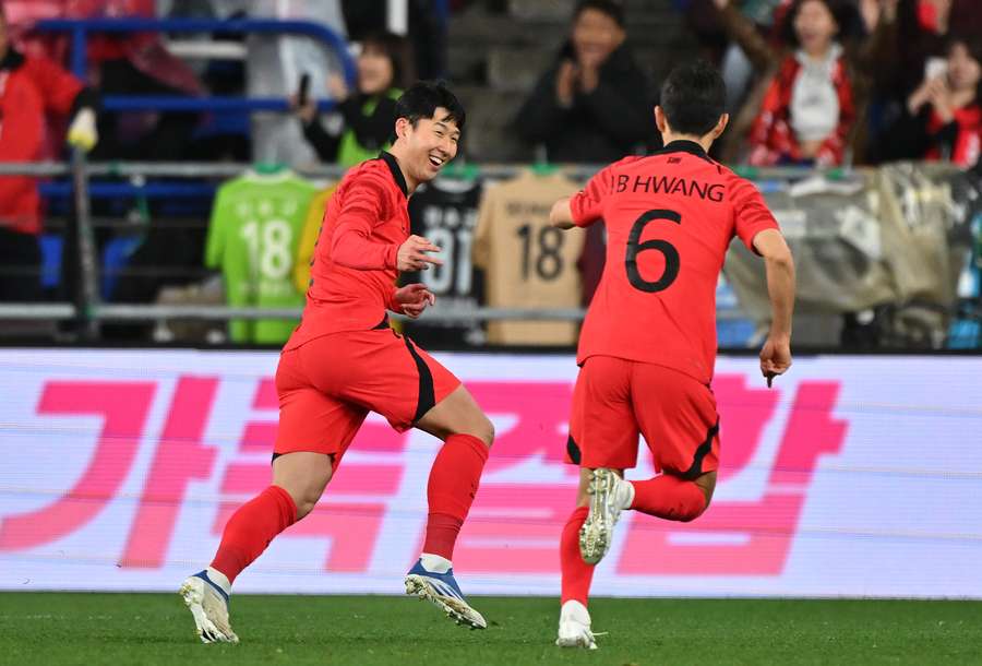 South Korea's Son Heung-min (L) celebrates his goal