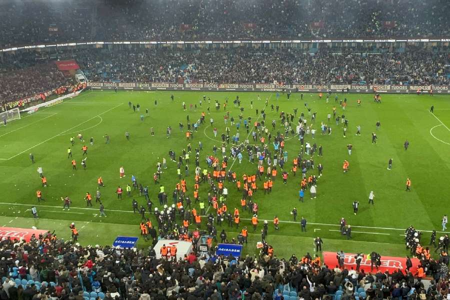 Trabzonspor fans invading the pitch and clashing with Fenerbahce players in March