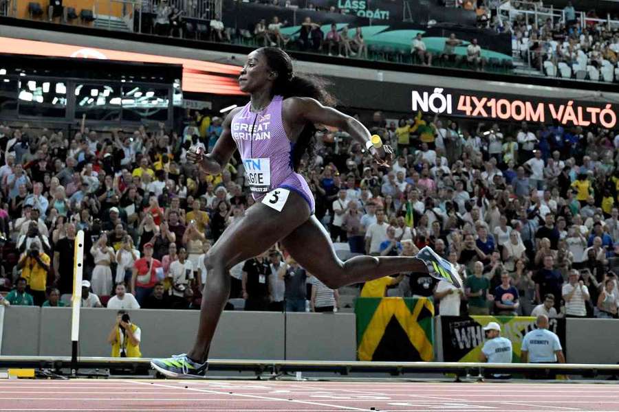 Britain's Annie Tagoe crosses the finish line in the women's 4x100m relay heats