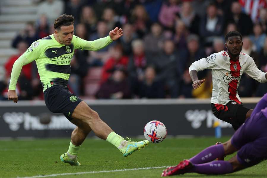 Grealish (L) fires in City's second goal