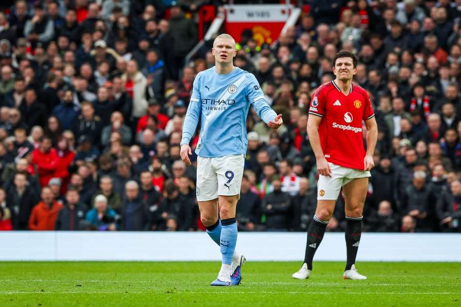Man City's Erling Haaland and Man United's Harry Maguire in a previous Manchester derby