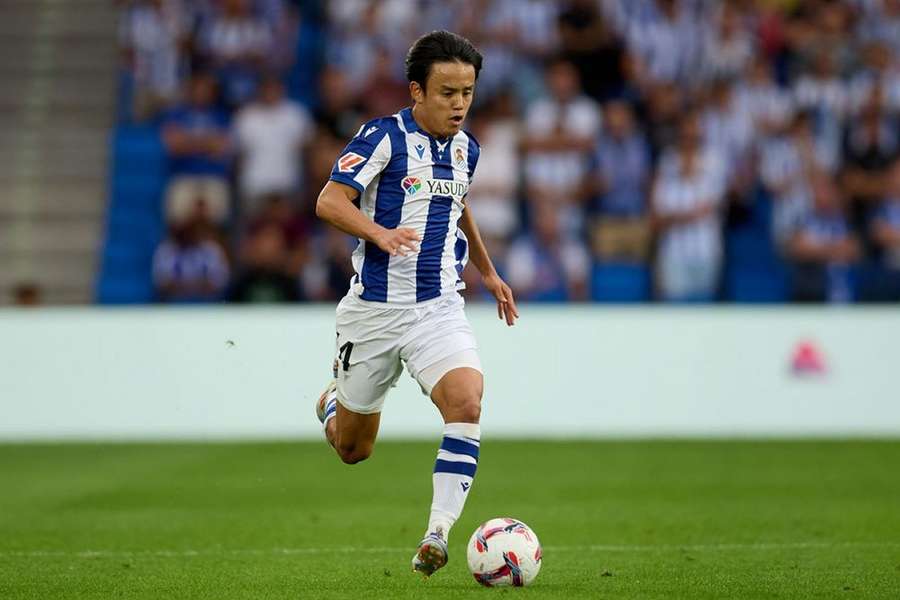 Dani Silva of FC Midtjylland competes for the ball with Ander Barrenetxea of Real Sociedad