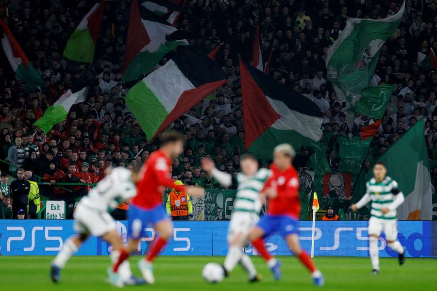 Celtic fans fly the Palestine flag at Celtic Park