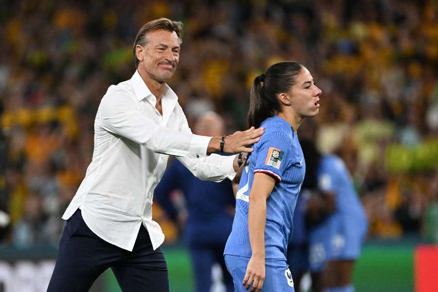 France's Maelle Lakrar with coach Herve Renard after they were knocked out of the World Cup