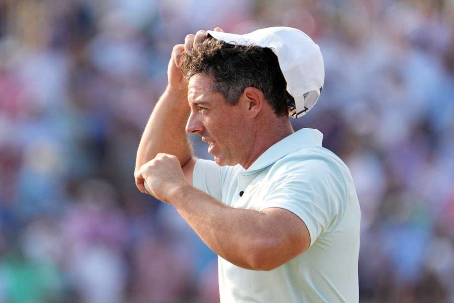McIlroy reacts on the 18th hole