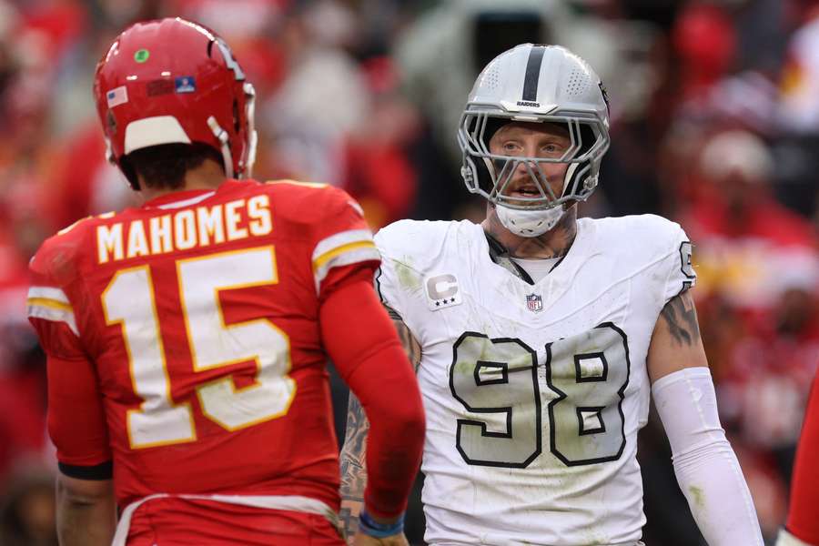 Maxx Crosby of the Las Vegas Raiders and Patrick Mahomes of the Kansas City Chiefs exchange words after a play