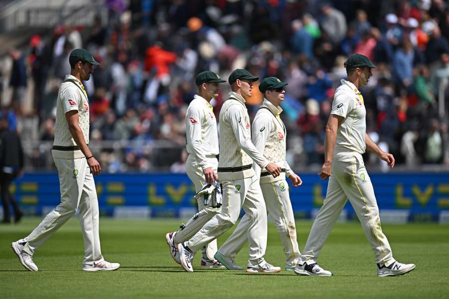 Some of Australia's players leave the field at Old Trafford