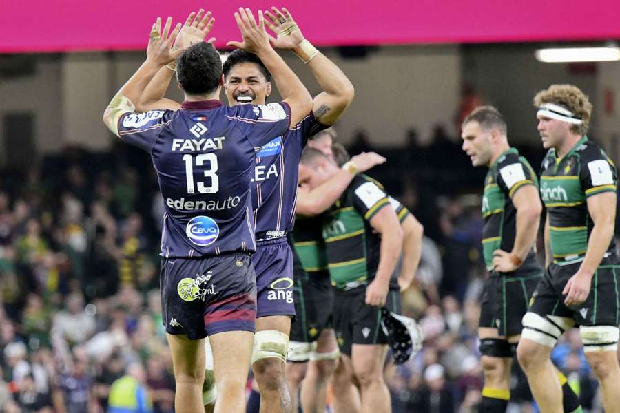 Nicolas Depoortere and Pete Samu celebrate after winning in Cardiff