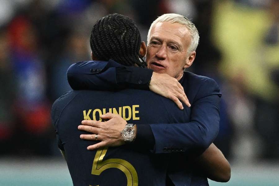 Didier Deschamps celebrates France's win with defender Jules Kounde