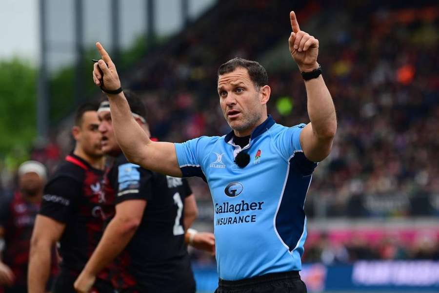 Referee Karl Dickson calls for a TMO review Referee Karl Dickson calls for a TMO review