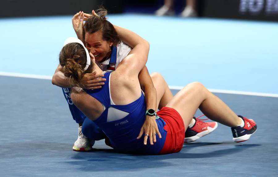 Linda Noskova celebrates with captain Barbora Strycova after winning her match against Elina Svitolina