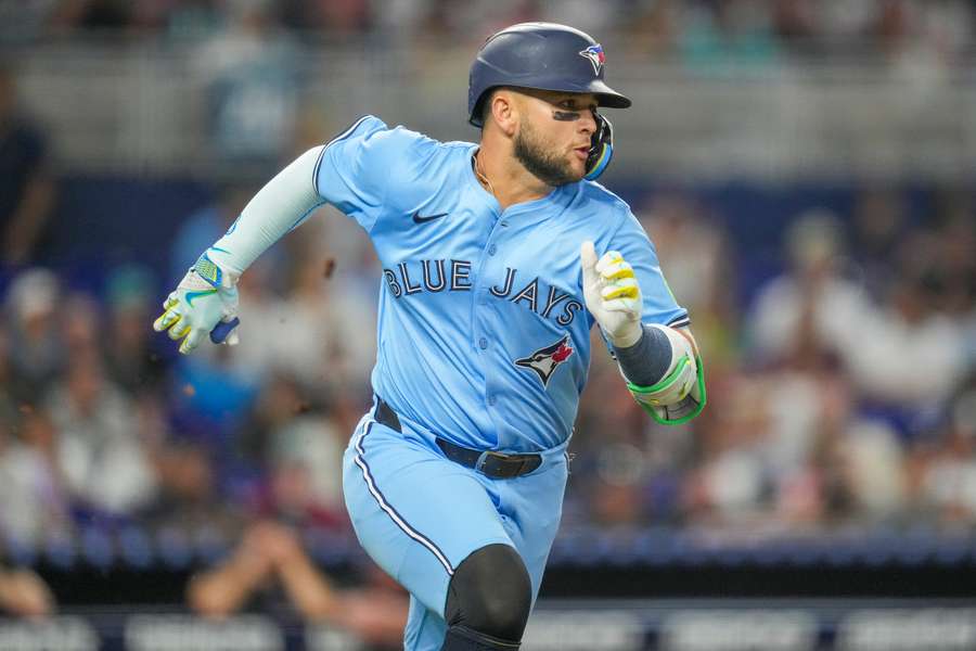 Bo Bichette running to first after a hit