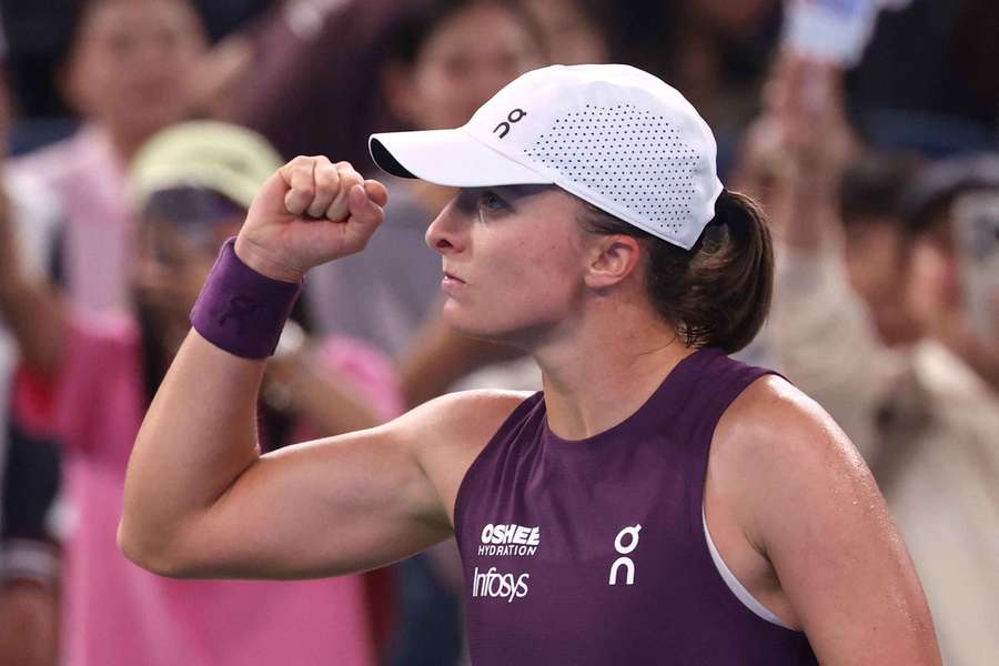 Iga Swiatek celebrates winning her quarterfinal match against Ann Li in Wuhan Iga Swiatek celebrates winning her quarterfinal match against Ann Li in Wuhan