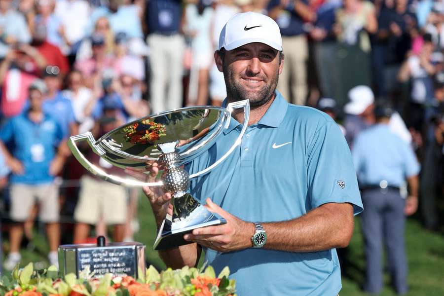 Scottie Scheffler poses with 2026 Tour Championship trophy Scottie Scheffler poses with 2026 Tour Championship trophy