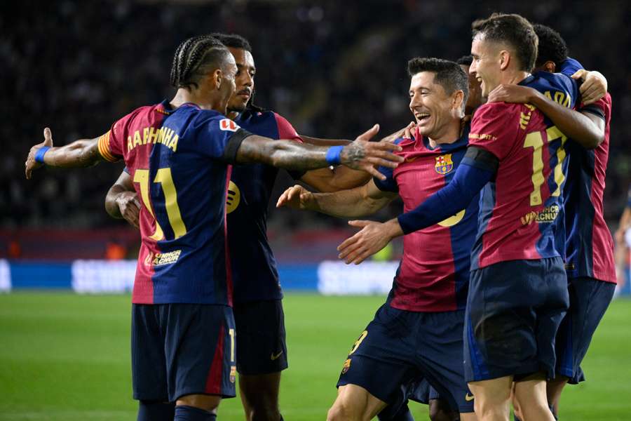 Robert Lewandowski celebrates with his Barcelona teammates after scoring