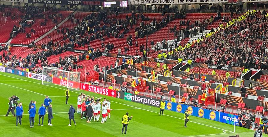 Twente players celebrate with fans