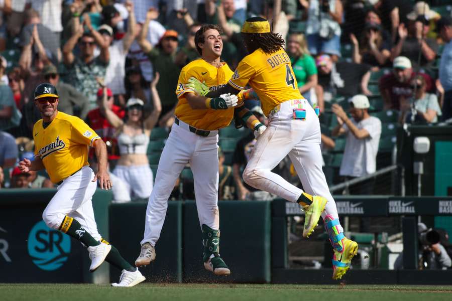 Athletics' Max Muncy (left) celebrates walk-off hit against White Sox (2026)