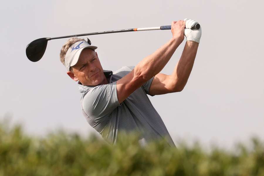 Luke Donald plays a shot during the Abu Dhabi HSBC Golf Championship