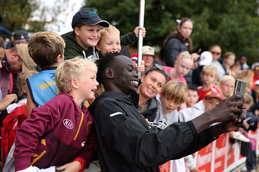 Gout Gout poses for a selfie with a fan at the 2025 Stawell Gift. Gout Gout poses for a selfie with a fan at the 2025 Stawell Gift.