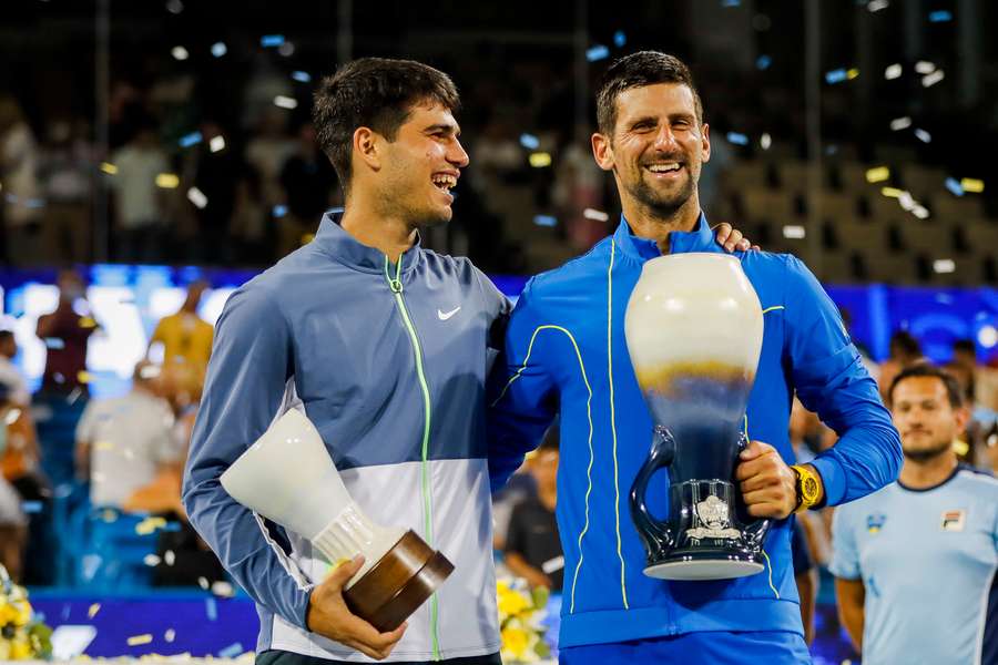 Alcaraz and Djokovic embrace at the trophy presentation