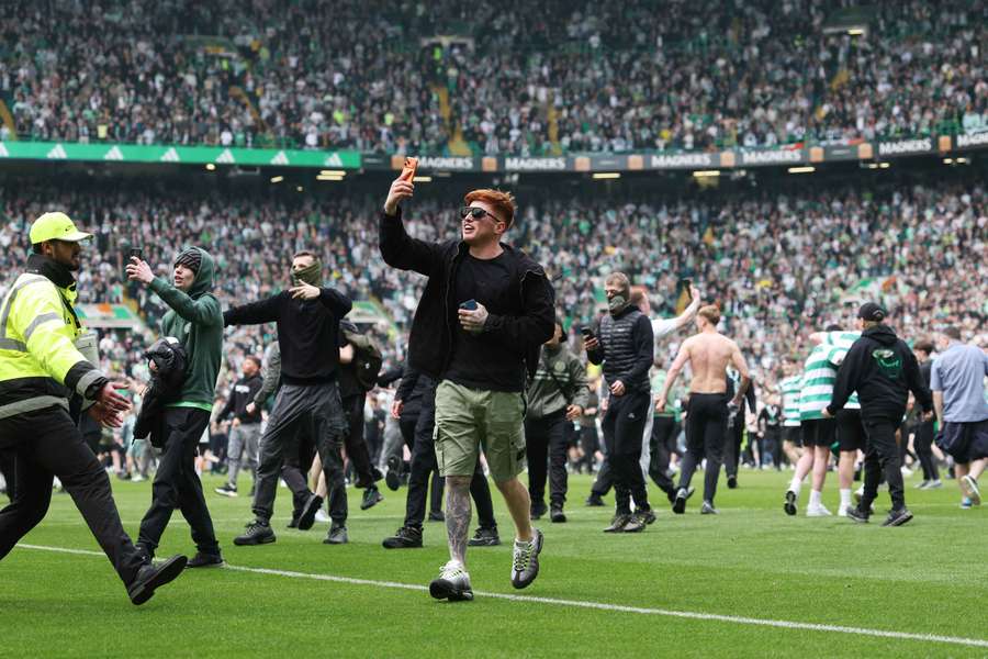 Some Celtic fans stormed the pitch after the full-time whistle