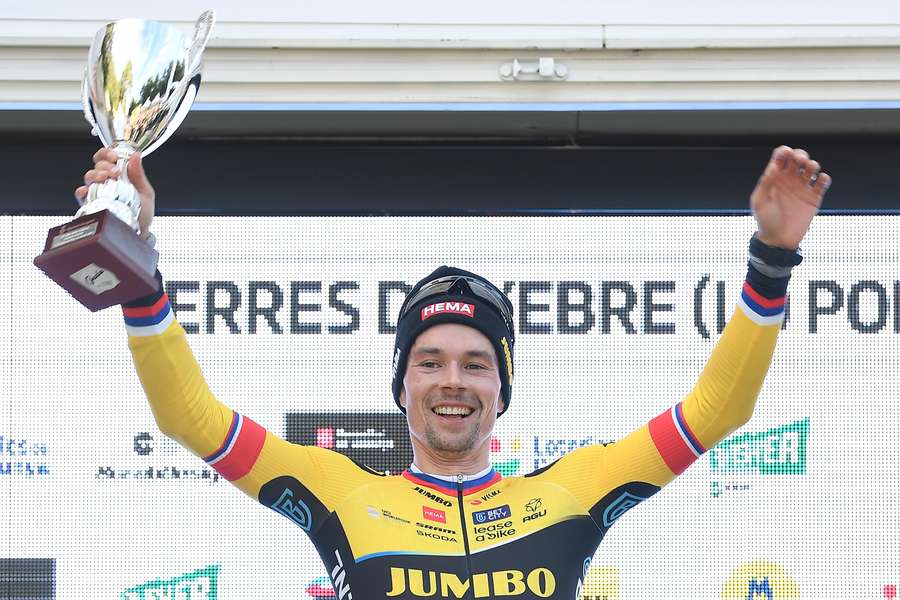 Team Jumbo-Visma's Slovenian rider Primoz Roglic celebrates on the podium