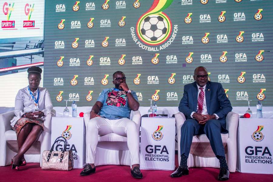 Former Ghanaian player Samuel Kuffour and fellow members of the Normalisation Committee sit onstage during the 2019 GFA president's election