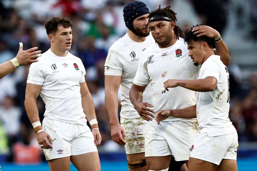 England wing Henry Arundell, lock George Martin and flanker Lewis Ludlam celebrate after fly-half Marcus Smith scored a try