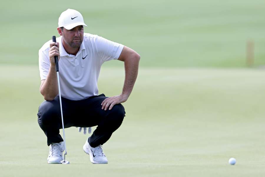 Scottie Scheffler of the United States lines up a putt