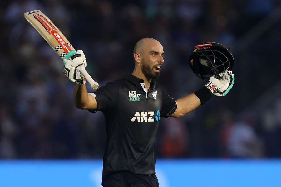 New Zealand's Daryl Mitchell celebrates his 100 runs