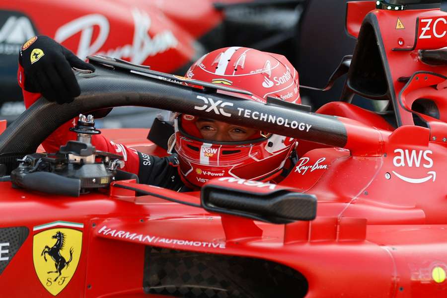 Ferrari's Monegasque driver Charles Leclerc gets out of his car after winning the pole position 