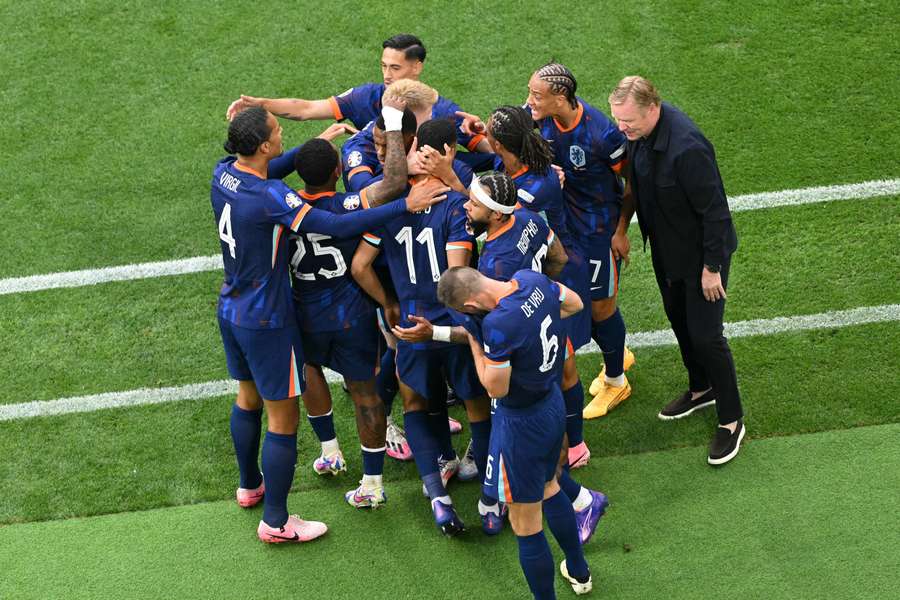 Netherlands' team celebrate their opening goal from Cody Gakpo