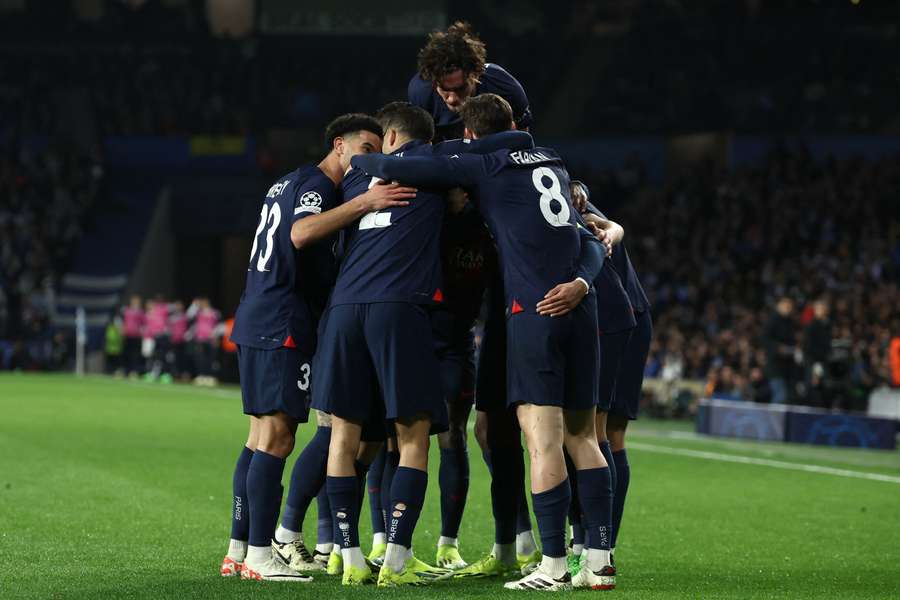 Paris Saint-Germain's players celebrate their second goal scored by French forward #07 Kylian Mbappe