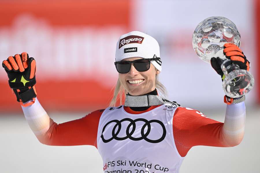 Lara Gut-Behrami celebrates with the overall trophy after Sunday's giant slalom