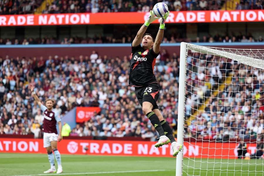 Aston Villa's Argentinian goalkeeper Emiliano Martinez catches the ball during the match against Fulham at Villa Park